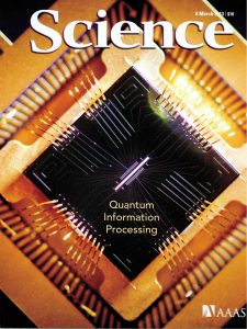 Picture of an ion trap chip, on Science cover.